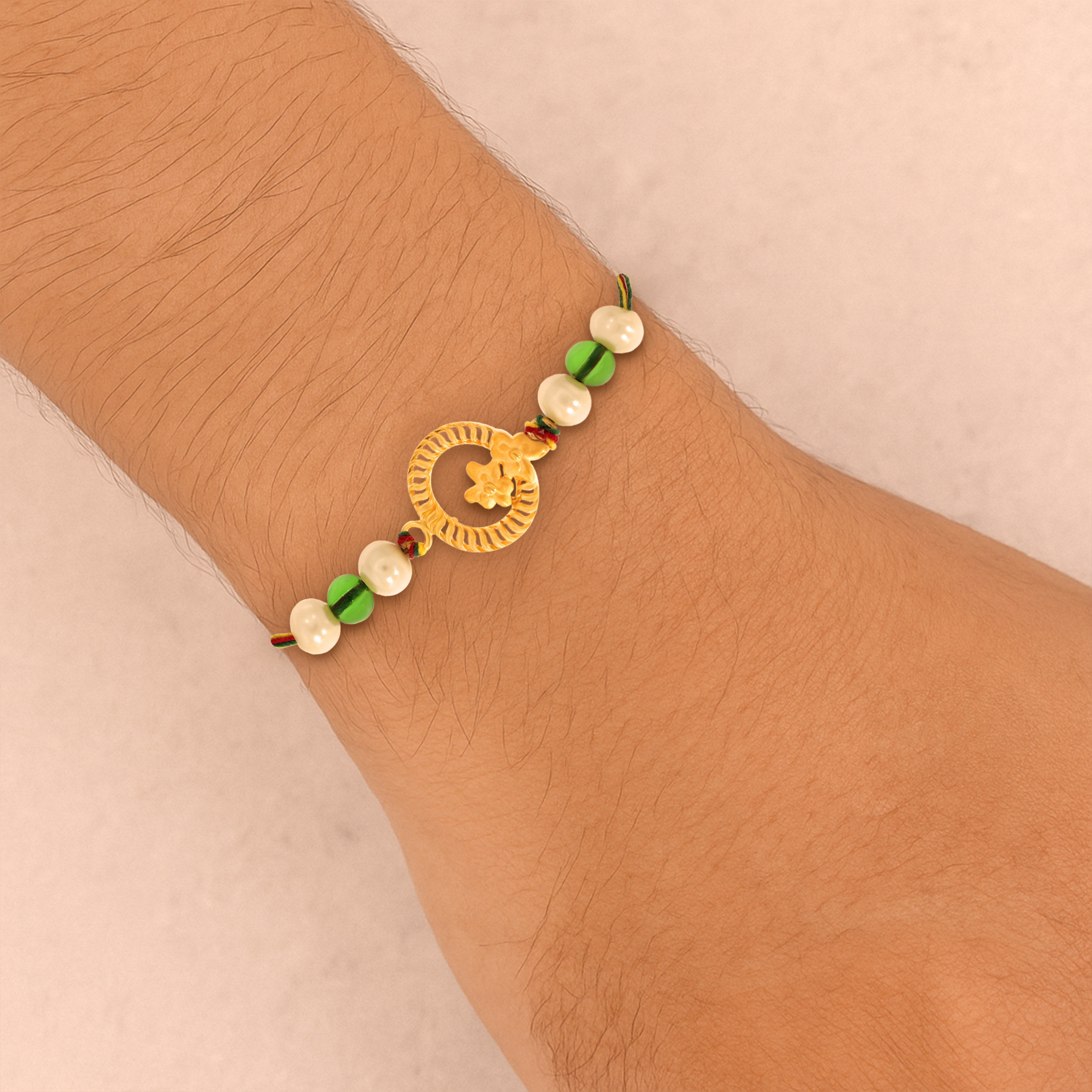 Floral Circle Gold Rakhi - Senco Gold and Diamonds