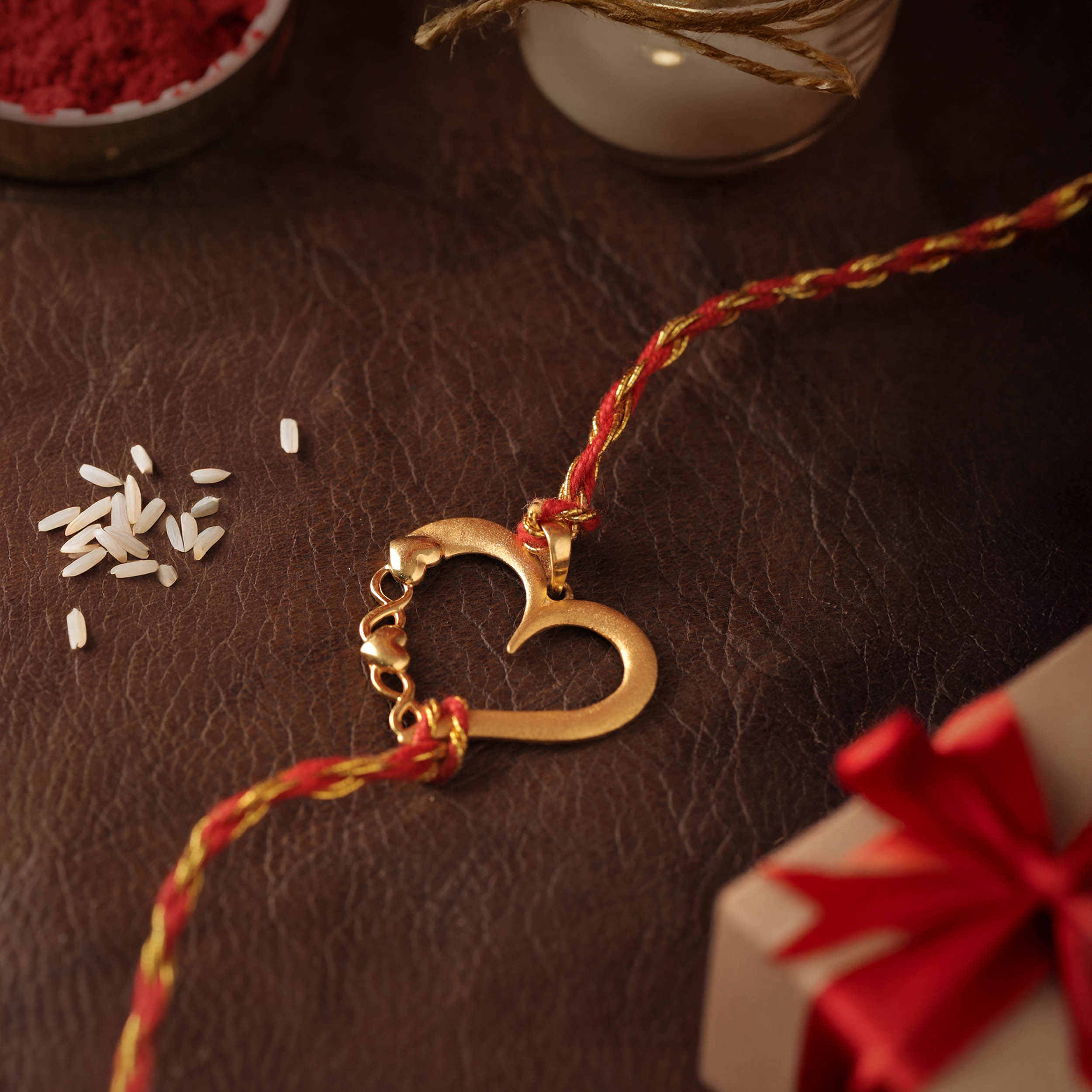 Heartline Keepsake Gold Rakhi Pendant - Senco Gold and Diamonds