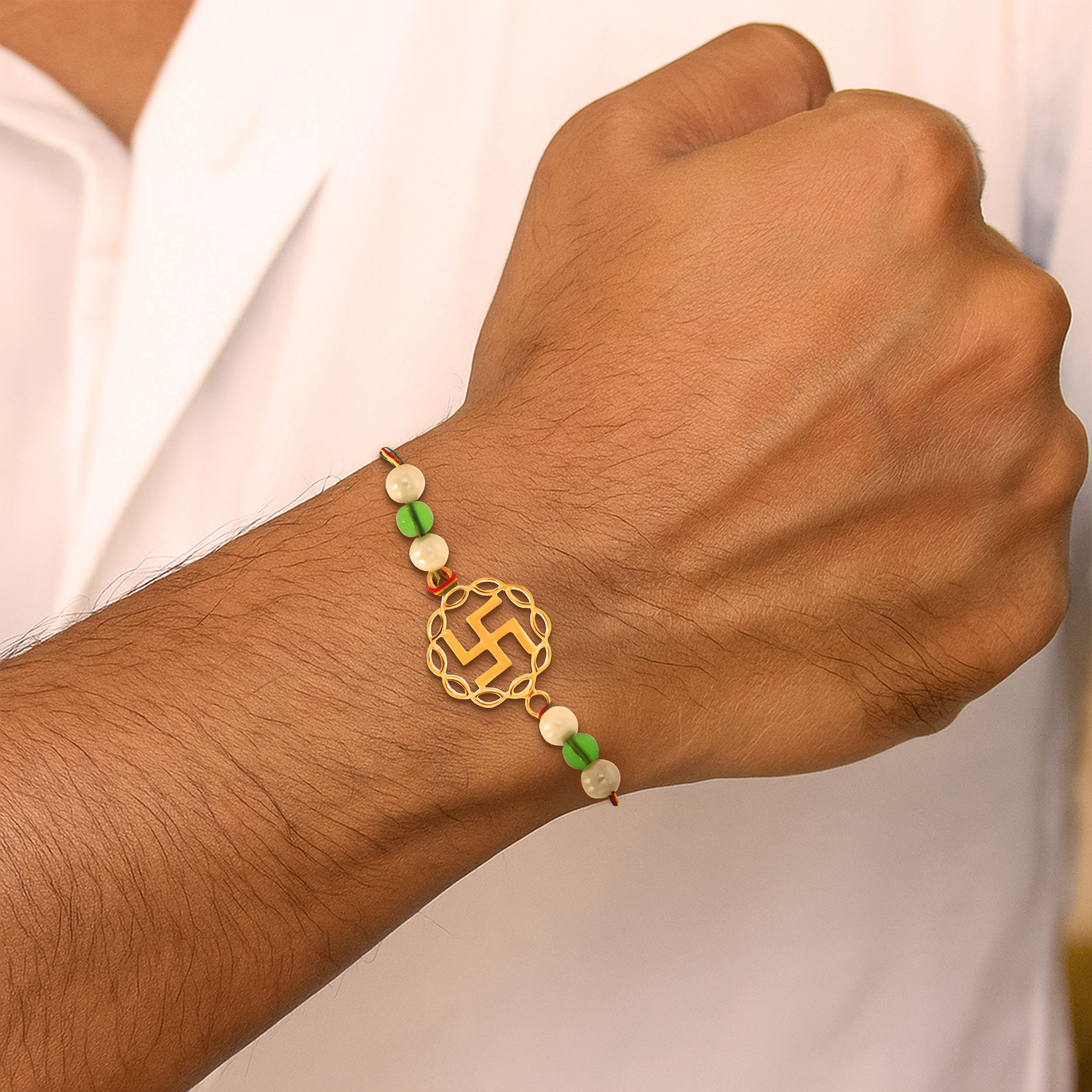 Auspicious Swastik Gold Rakhi - Senco Gold and Diamonds