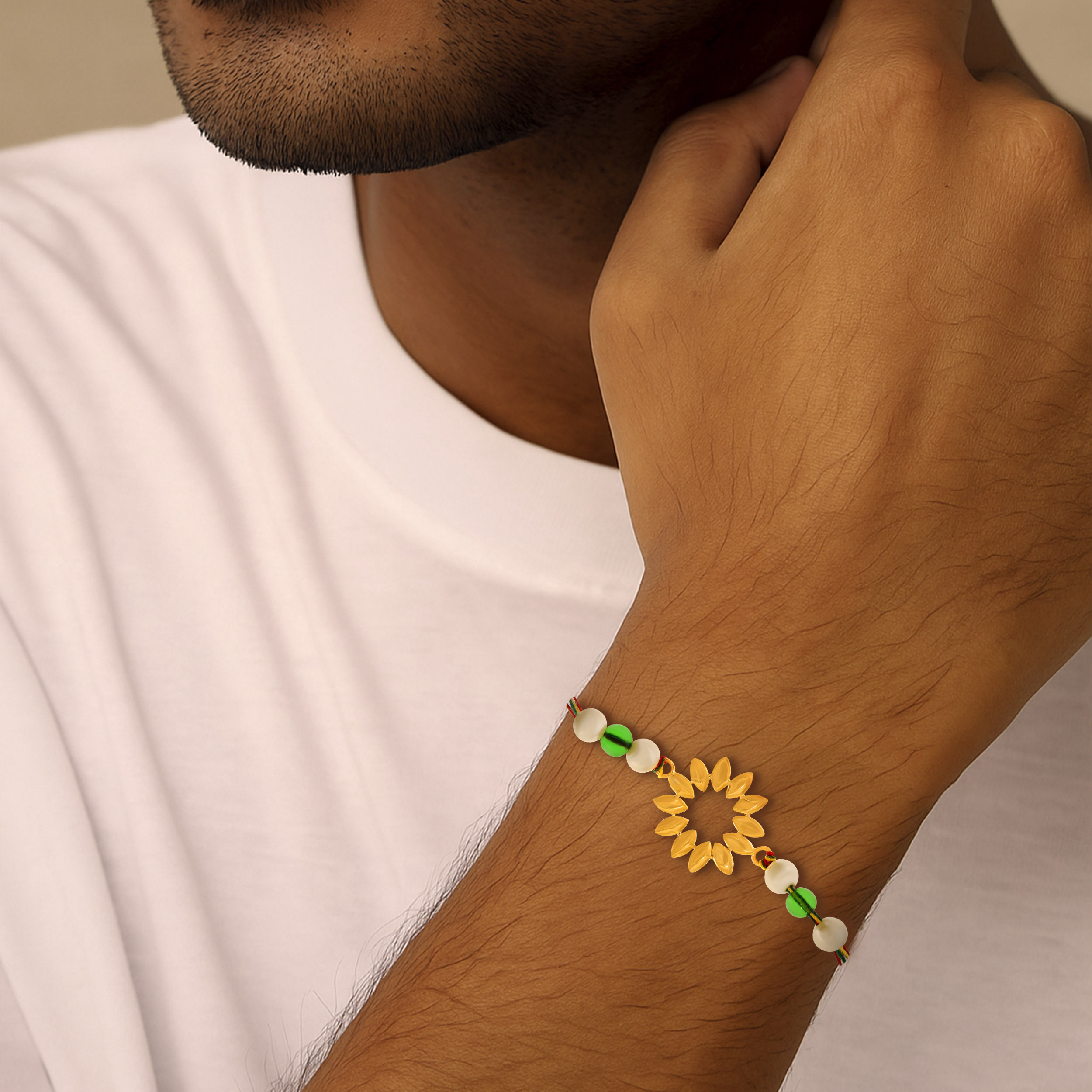 Sunburst Gold Rakhi - Senco Gold and Diamonds